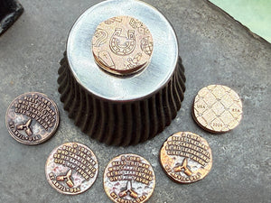 The Anvil Prayer Coin